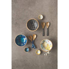 Ziggy Mango Wood Serving Utensil - Elegant serving utensils with white abstract design and mango wood handles, ideal for meal presentations.