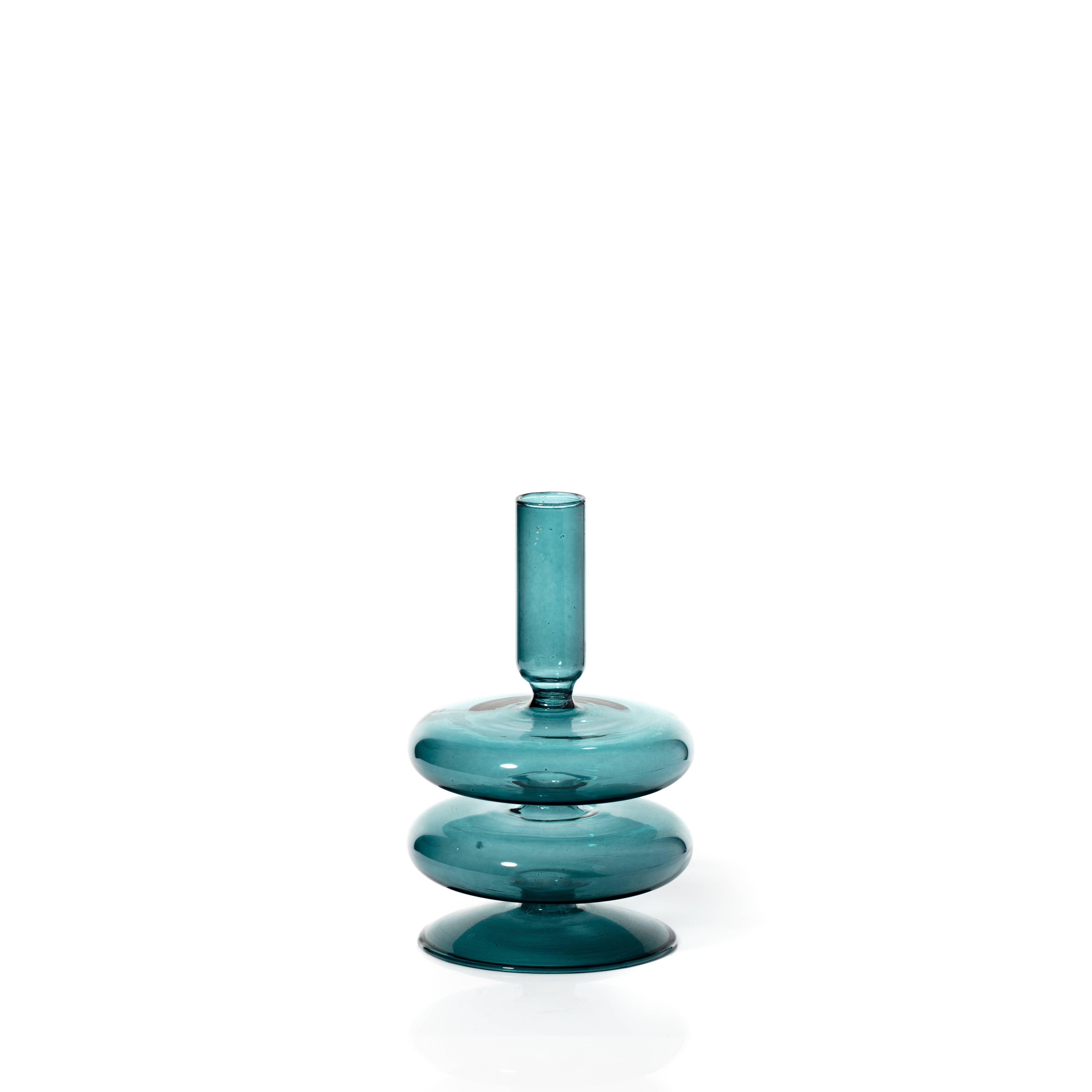 Ocean Teal Coloured Glass Taper Holder, reflecting a calming, sea-inspired glow.