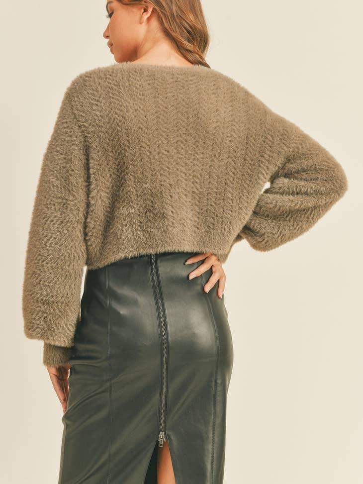 Cropped Sweater - A trendy and comfortable cropped sweater for a chic and relaxed look.