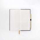 Image showcasing the 'Deep Dark Secrets Notebook', featuring an elegant, dark cover.