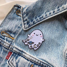Iridescent glitter ghost patch with cosmic details - planet, moon, and stars, bordered by a shimmering gold trim.