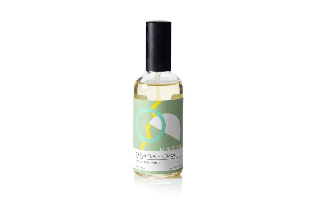 Bottle of Room Fragrance - Cucumber + Basil sitting on a table, emitting a refreshing, invigorating scent.