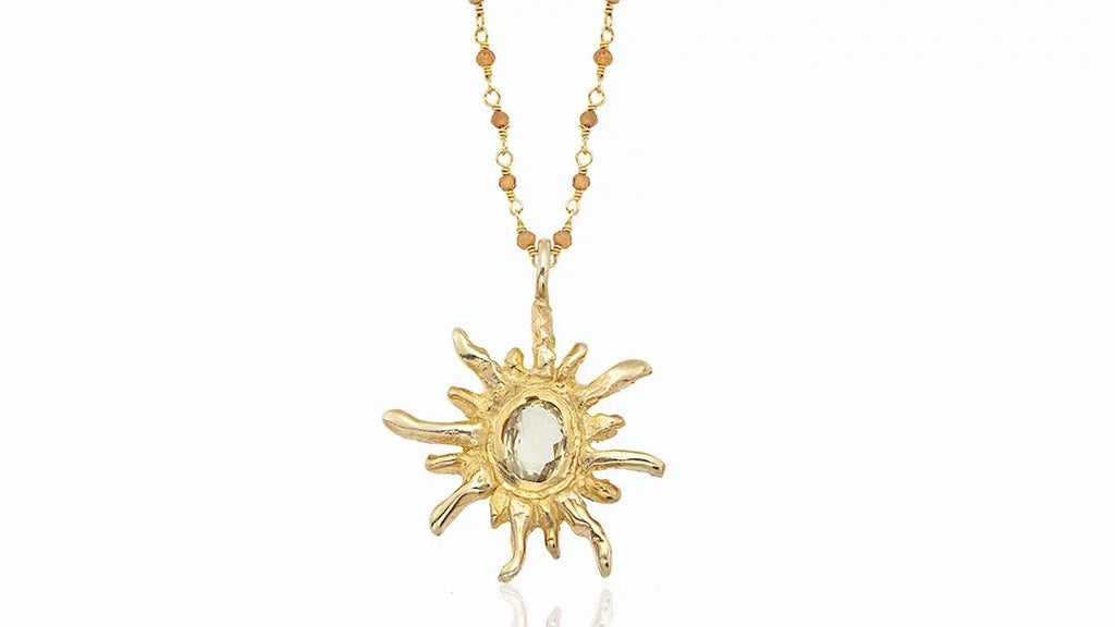 Helio Necklace - A radiant sunburst design symbolizing celestial elegance.
