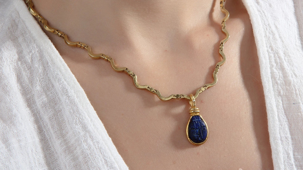 Khepri Necklace - Intricately crafted scarab beetle pendant, symbolizing transformation and protection.