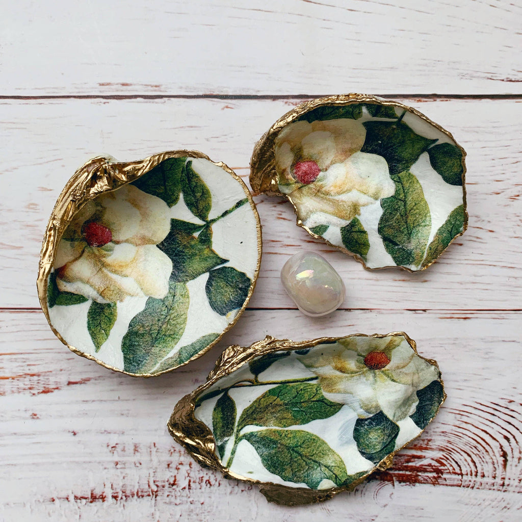 Sugar Magnolia Shell, a beautifully painted shell with an exquisite depiction of the Magnolia flower.