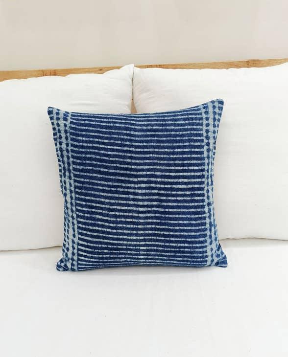 Image of the 'Indigo Blue Square Pillow Cover', showcasing its vibrant indigo color and fine cotton material, designed by Indian master artisans.