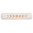 A beautiful stoneware incense holder featuring a moon phase design with a wax resist finish, giving it a handmade feel.