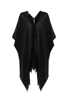 A woman gracefully wearing the Ava Kimono, showcasing its flowing silhouette, delicate patterns, and high-quality fabric.
