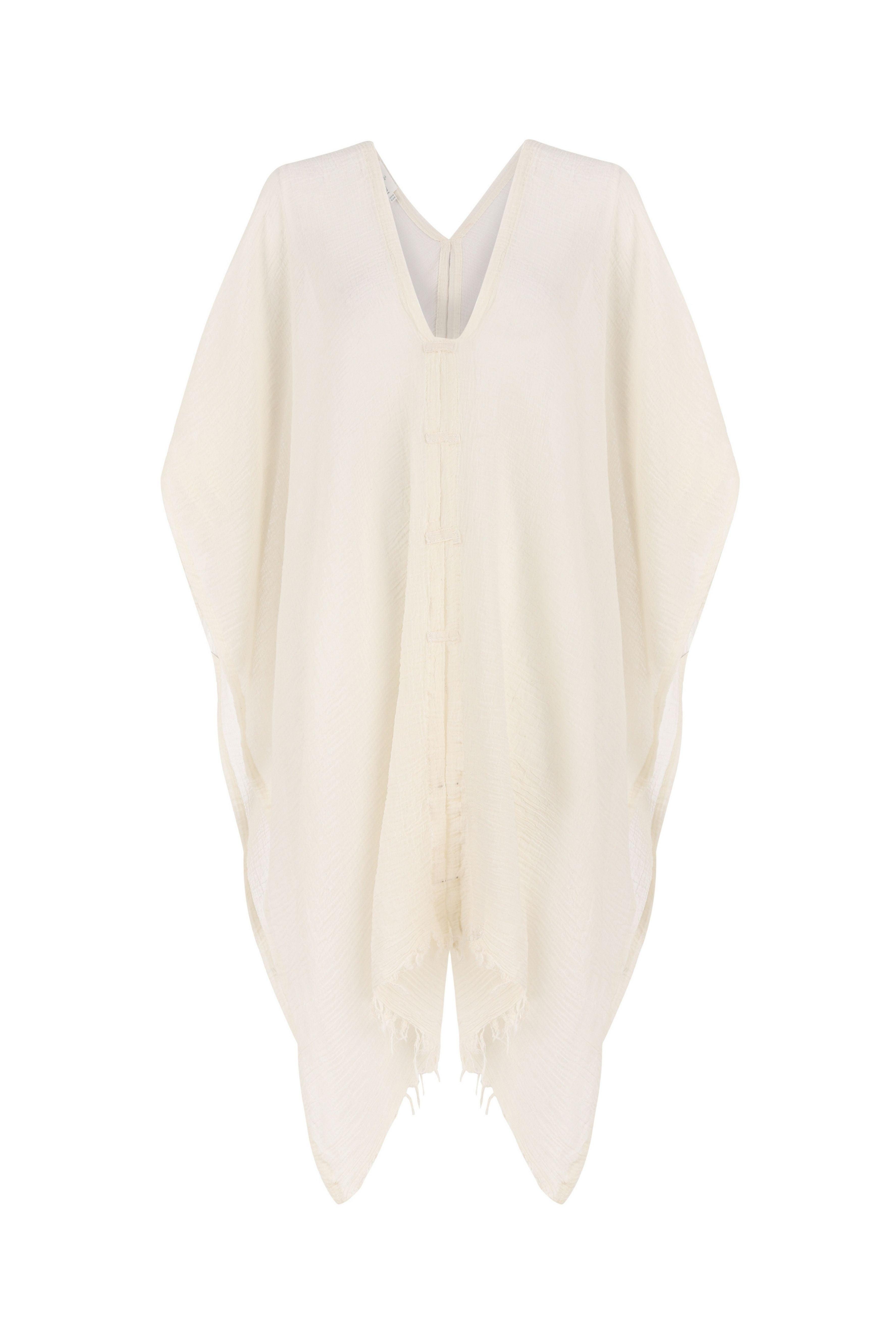 A woman gracefully wearing the Ava Kimono, showcasing its flowing silhouette, delicate patterns, and high-quality fabric.