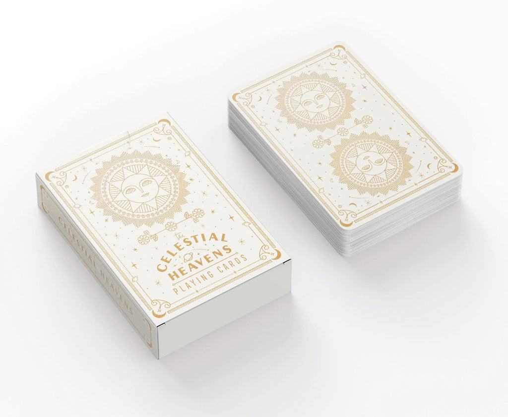 Image of Celestial Heavens Playing Cards with sleek cosmic designs, gold foil-stamped cards and a matching tuck box.