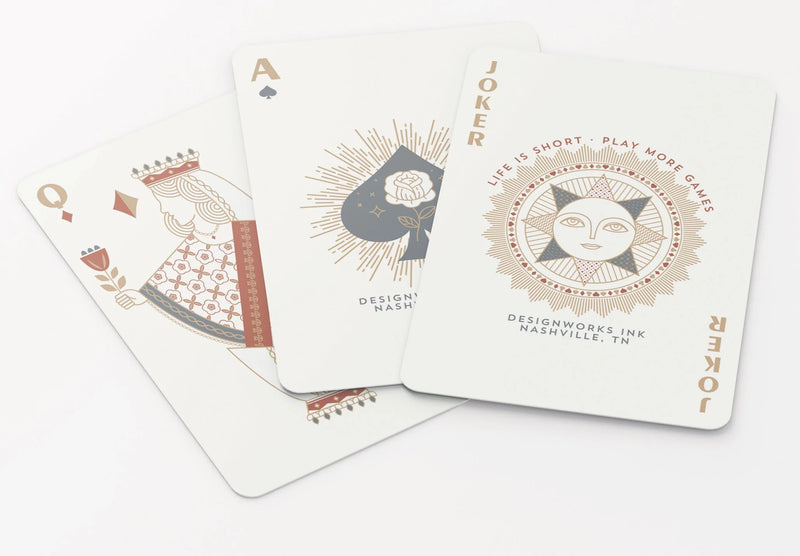 Image of Celestial Heavens Playing Cards with sleek cosmic designs, gold foil-stamped cards and a matching tuck box.