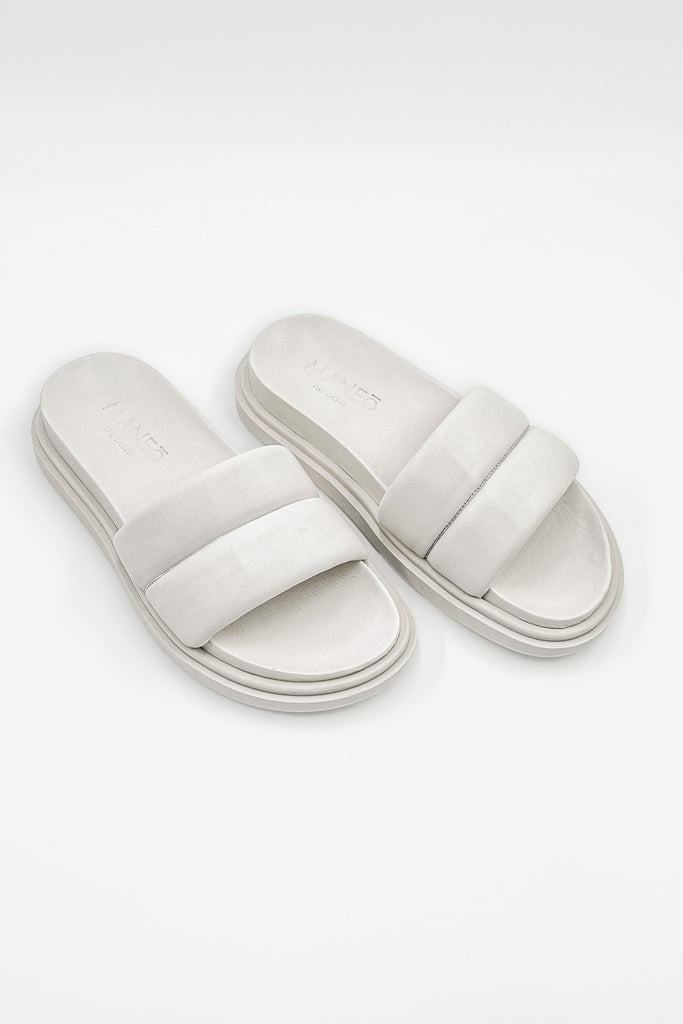 Diana Sandals, crafted from 100% genuine leather, displayed elegantly against a neutral background, showcasing their classic and timeless design.