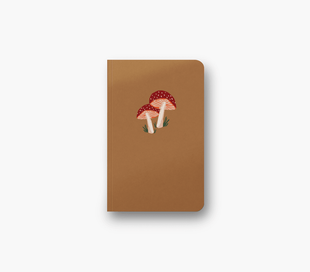 Golden Mushroom Notebook with a sparkling, gold-embossed fungi design on a dark, matte cover.