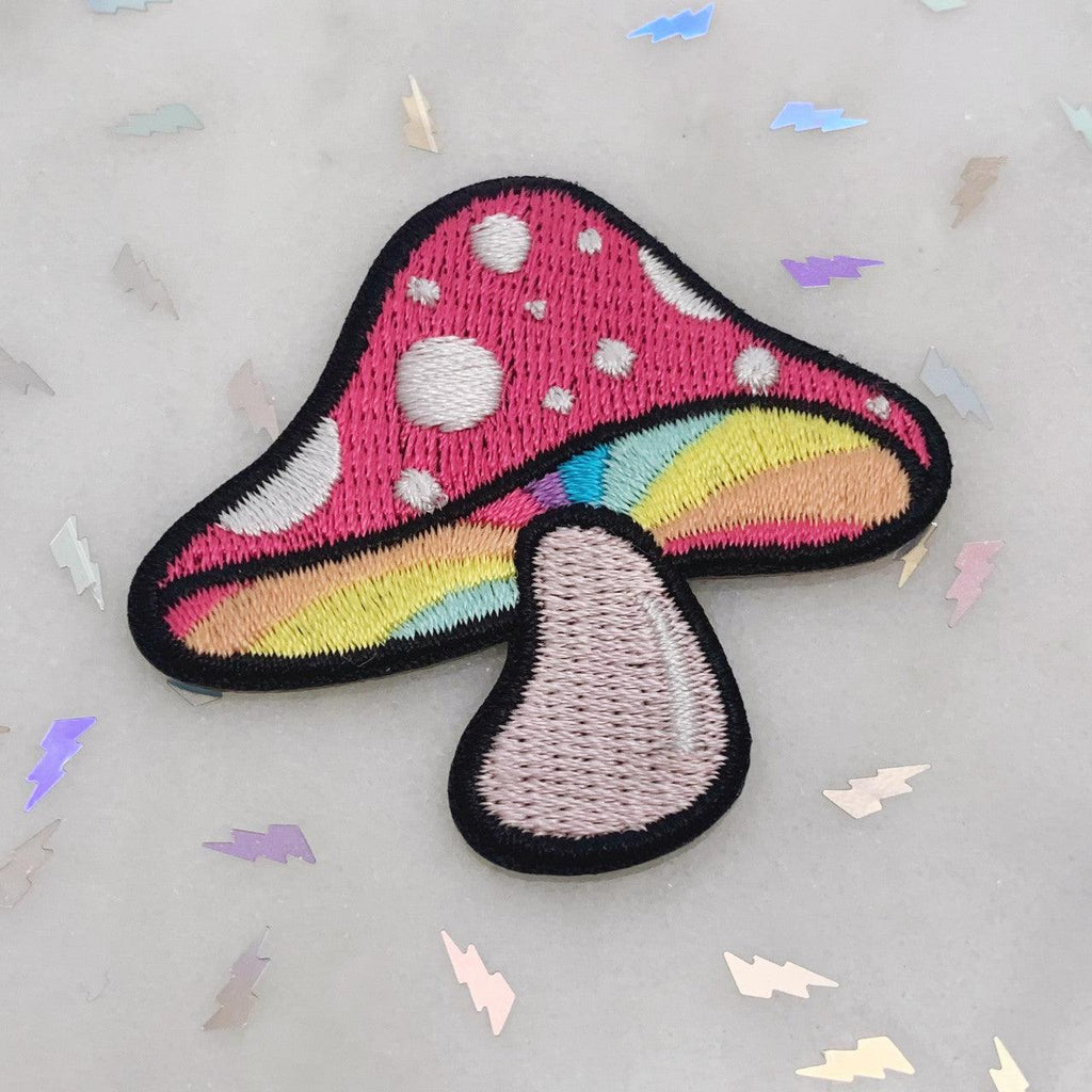 Embroidered patch featuring a colorful and intricate mushroom design reminiscent of magical realms.