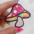 Embroidered patch featuring a colorful and intricate mushroom design reminiscent of magical realms.