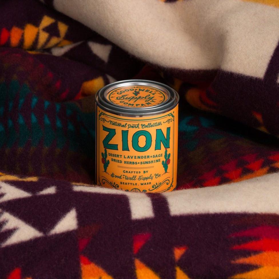 Zion Soy Candle in sustainable packaging, diffusing a striking, earthy scent reminiscent of the unique desert park.
