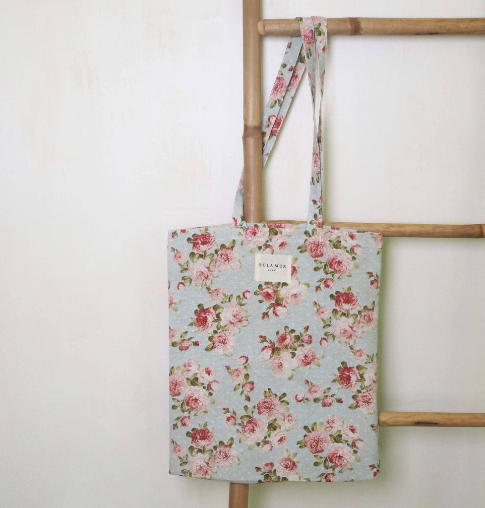  Floral Tote Small constructed from durable materials, featuring a vibrant floral design with just the right amount of space