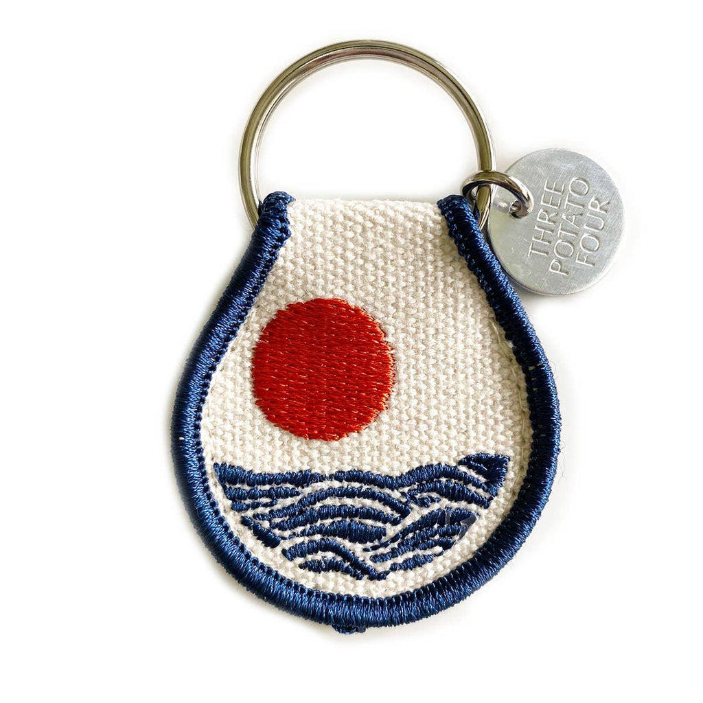 Sun & Waves Patch Keychain - A trendy key accessory with a vibrant sun and waves patch design.