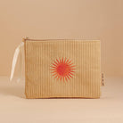 'Solis Corduroy Pouch' crafted from plush corduroy, featuring a sunny motif