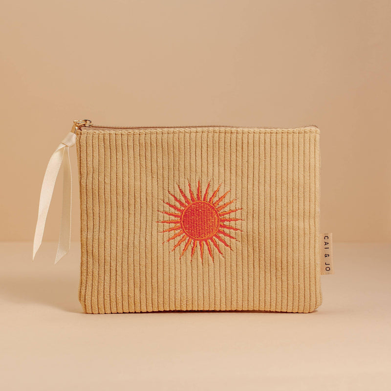 'Solis Corduroy Pouch' crafted from plush corduroy, featuring a sunny motif