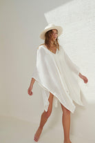 A woman gracefully wearing the Ava Kimono, showcasing its flowing silhouette, delicate patterns, and high-quality fabric.