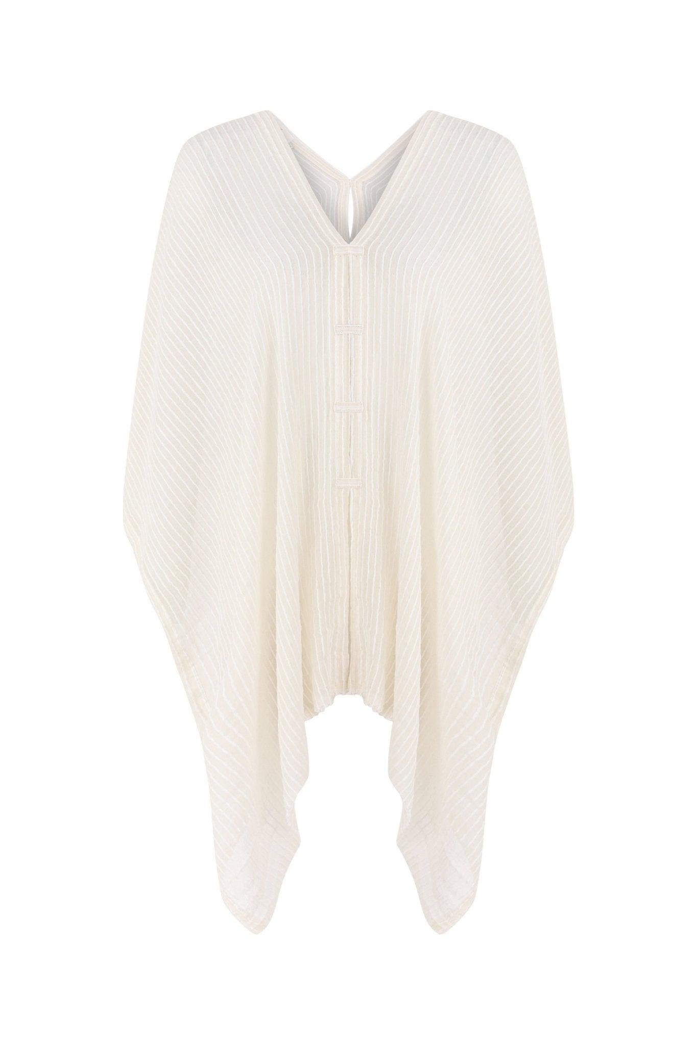 A woman gracefully wearing the Ava Kimono, showcasing its flowing silhouette, delicate patterns, and high-quality fabric.