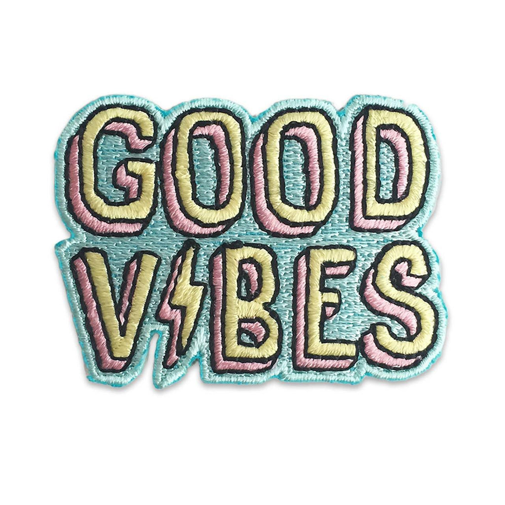 Colorful embroidered patch with the message "Good Vibes" in bold letters.