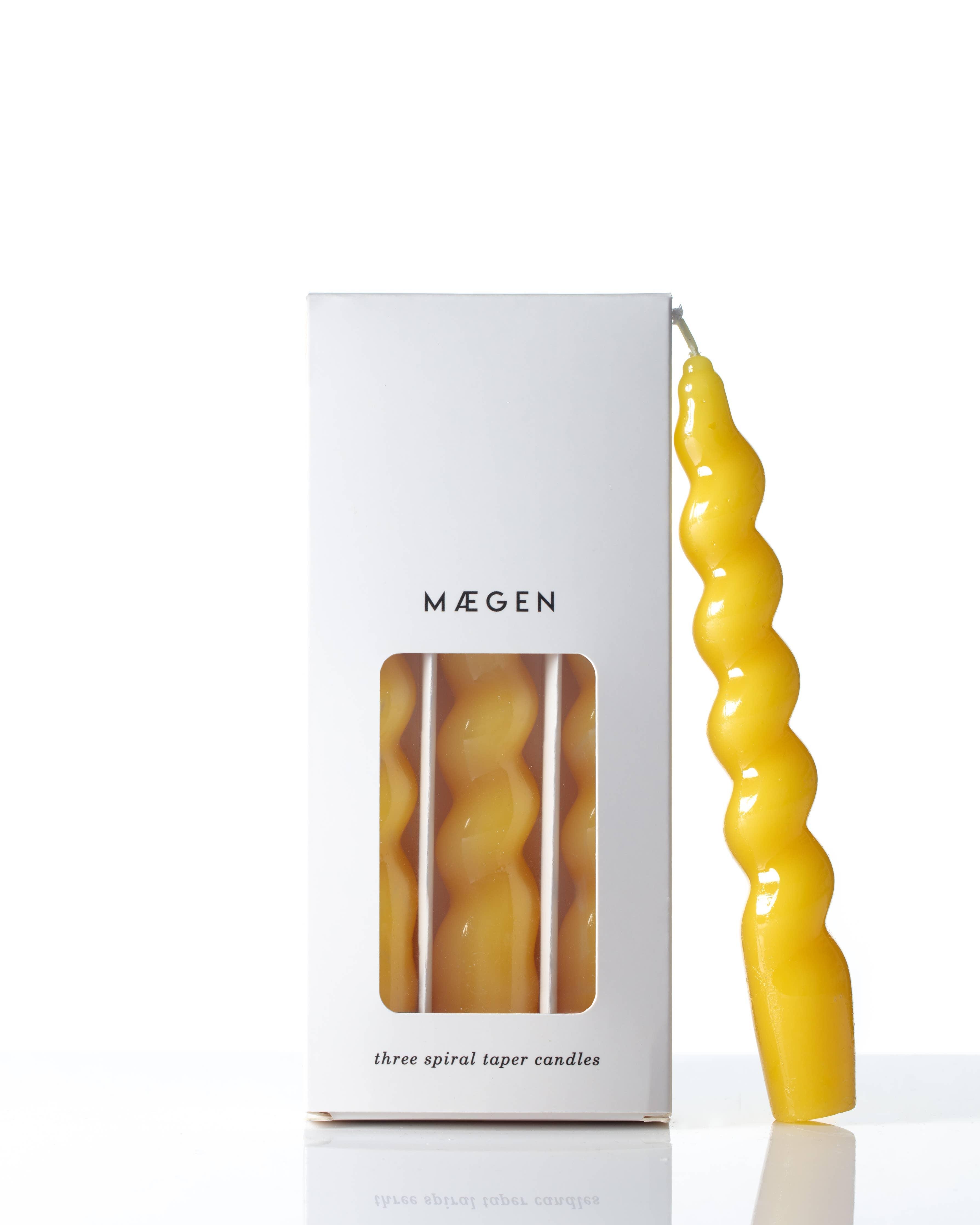 ellow Spiral Taper Candles, beautifully twisted, giving off a warm, bright light.