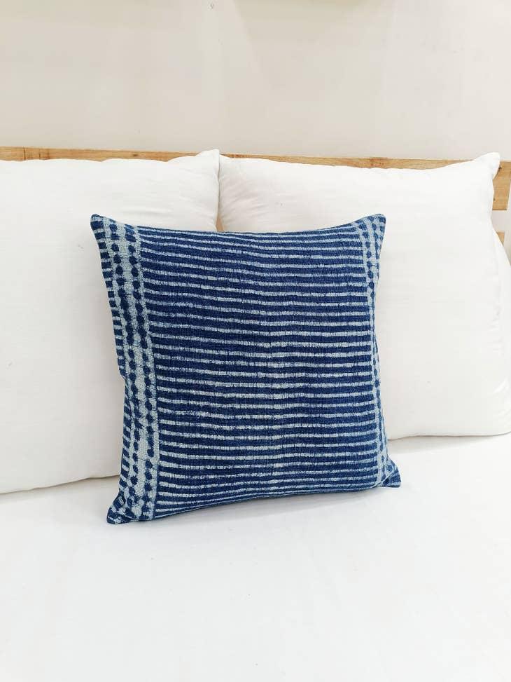 Image of the 'Indigo Blue Square Pillow Cover', showcasing its vibrant indigo color and fine cotton material, designed by Indian master artisans.