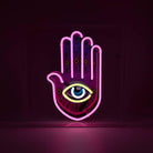 Yellow, pink, and white Neon Hamsa Hand Light encased in a glossy acrylic box with printed graphics by FORMA.