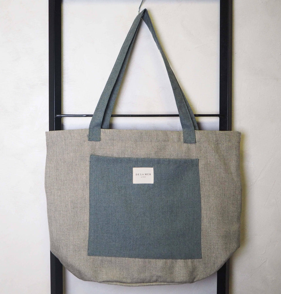 Mic Pocket Tote Large made from robust materials, showing a sleek design with ample space