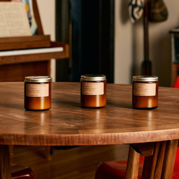 Spruce Soy Candle in sustainable packaging, releasing a fresh, revitalizing spruce forest scent.