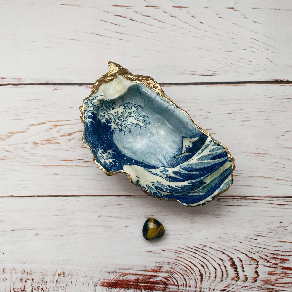 The Wave Shell, a beautiful decorative object depicting a dynamic ocean wave, capturing the essence of the sea's power and grace.