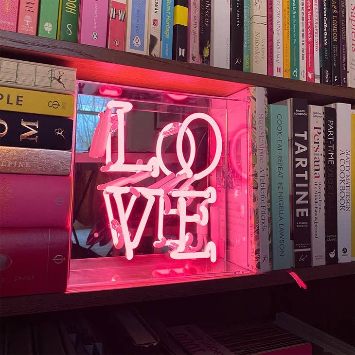 FORMA's Neon Love Box Light, a radiant symbol of love enclosed in a stylish box, perfect for any decor.