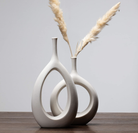 Modern Blanc Bud Vessel - Sleek and versatile white porcelain vessel designed to showcase single blooms or small arrangements.