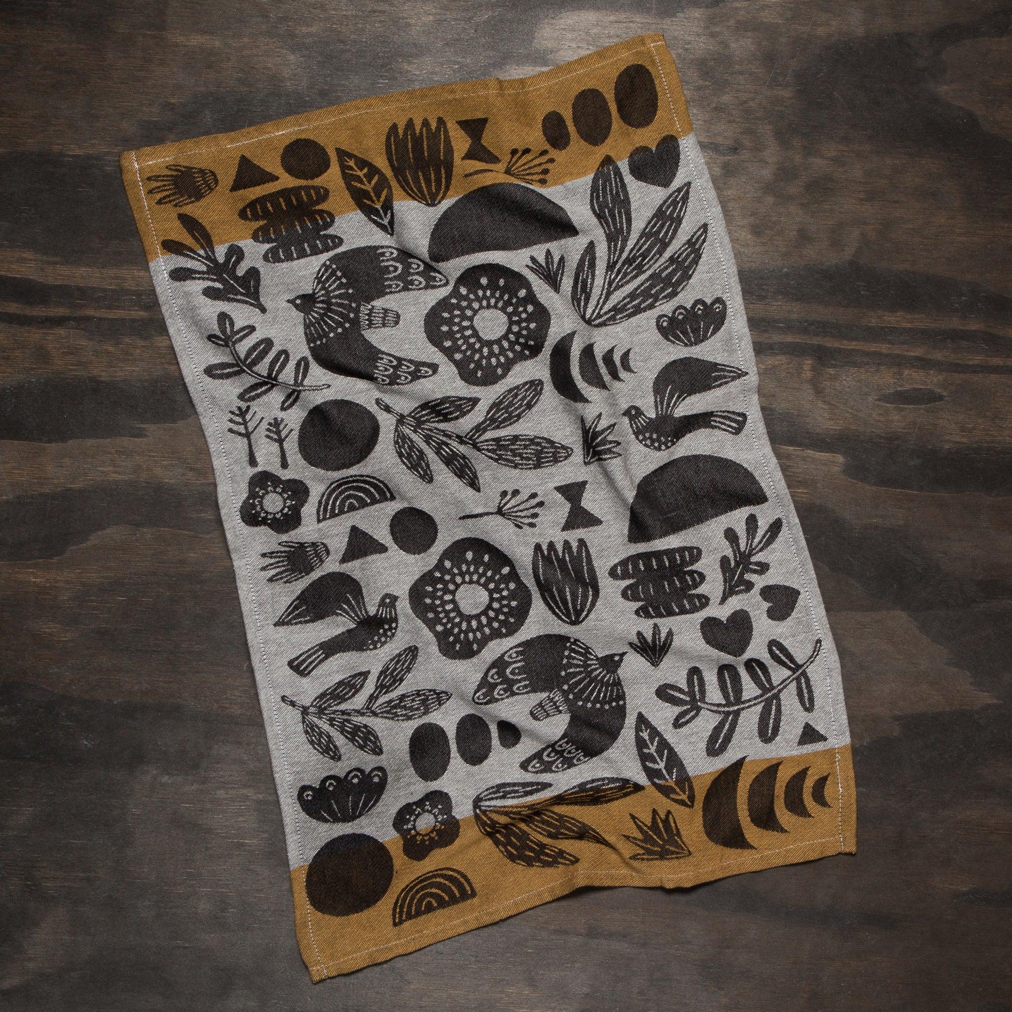 Myth Jacquard Towel - Intricately woven dishtowel blending bold geometrics and organic shapes in rich hues.
