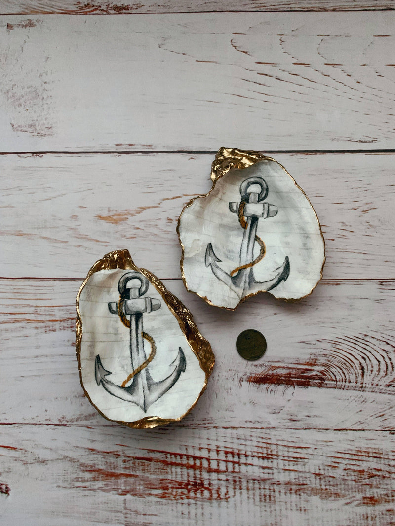 Anchor Shell, a decorative item with a beautifully painted anchor, symbolizing stability and strength.