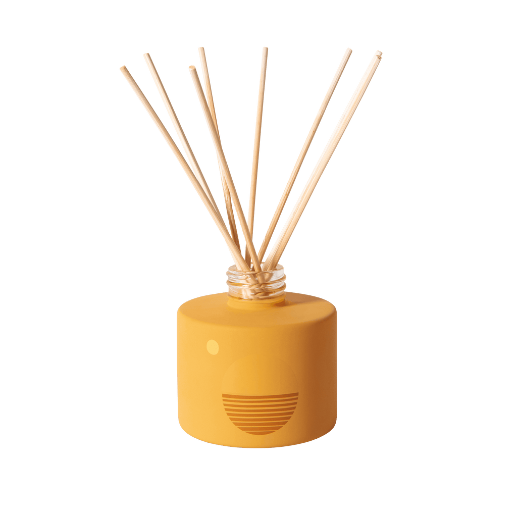 Golden Hour Reed Diffuser with stylish bottle and natural reeds, emanating a warm and inviting aroma.