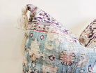 Image of the 'Handmade Printed Persian Cotton Cushion Cover', featuring its soft and fluffy texture, the handmade tassels at each corner, and the intricate printed design.