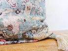 Image of the 'Handmade Printed Persian Cotton Cushion Cover', featuring its soft and fluffy texture, the handmade tassels at each corner, and the intricate printed design.