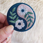 Botanical Yin Yang Patch, displaying the elegant fusion of yin and yang symbol with intricate botanical designs.