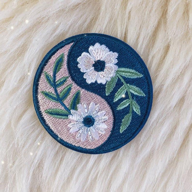 Botanical Yin Yang Patch, displaying the elegant fusion of yin and yang symbol with intricate botanical designs.