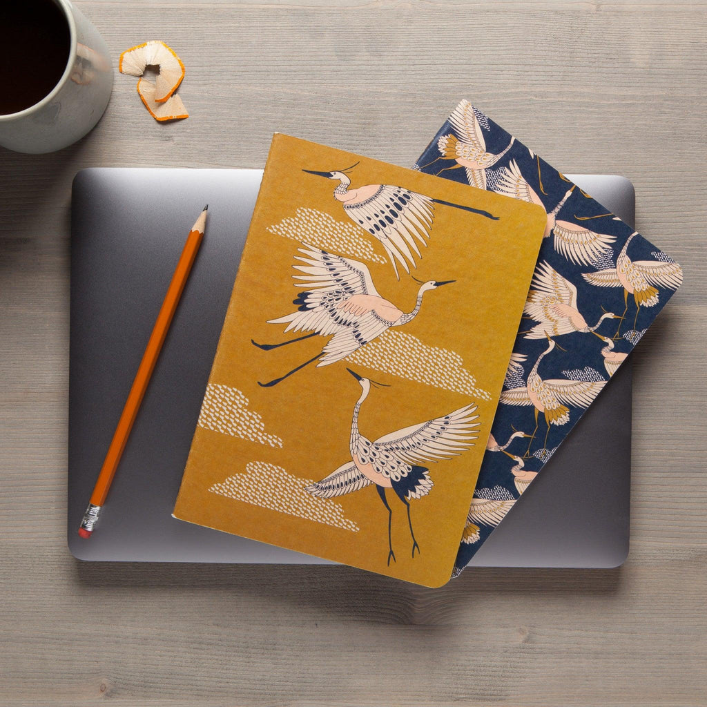 Golden Crane Notebook - Soft-bound notebook featuring a graceful avian design.
