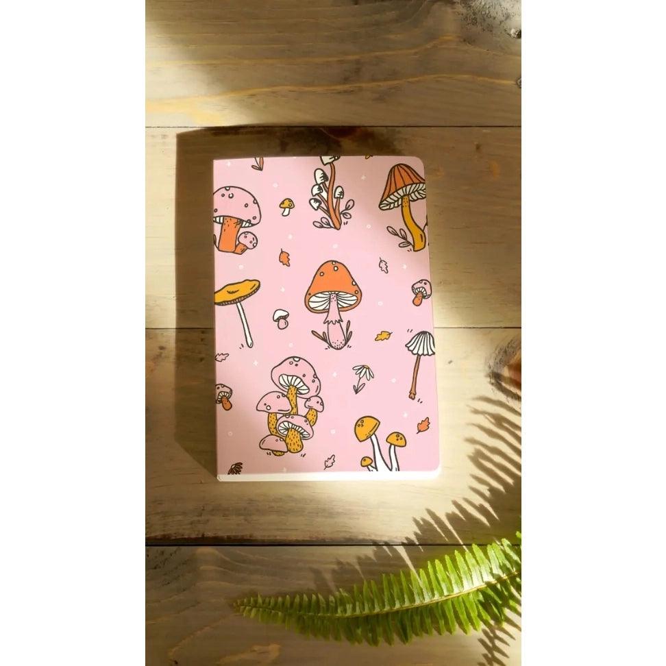 Pink Mushrooms Notebook featuring a captivating mushroom design on a soft pink cover.