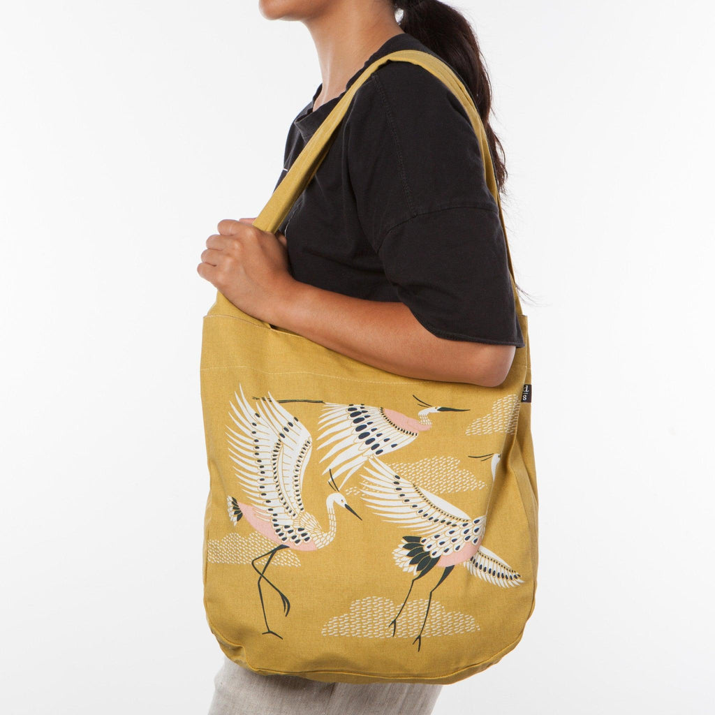 Crane Tote Bag with a stylish crane design, showing its spacious interior and sturdy handles.