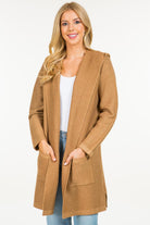 Calvin Cardigan showcasing its classic design and soft fabric, an ideal addition to any wardrobe for warmth and style.