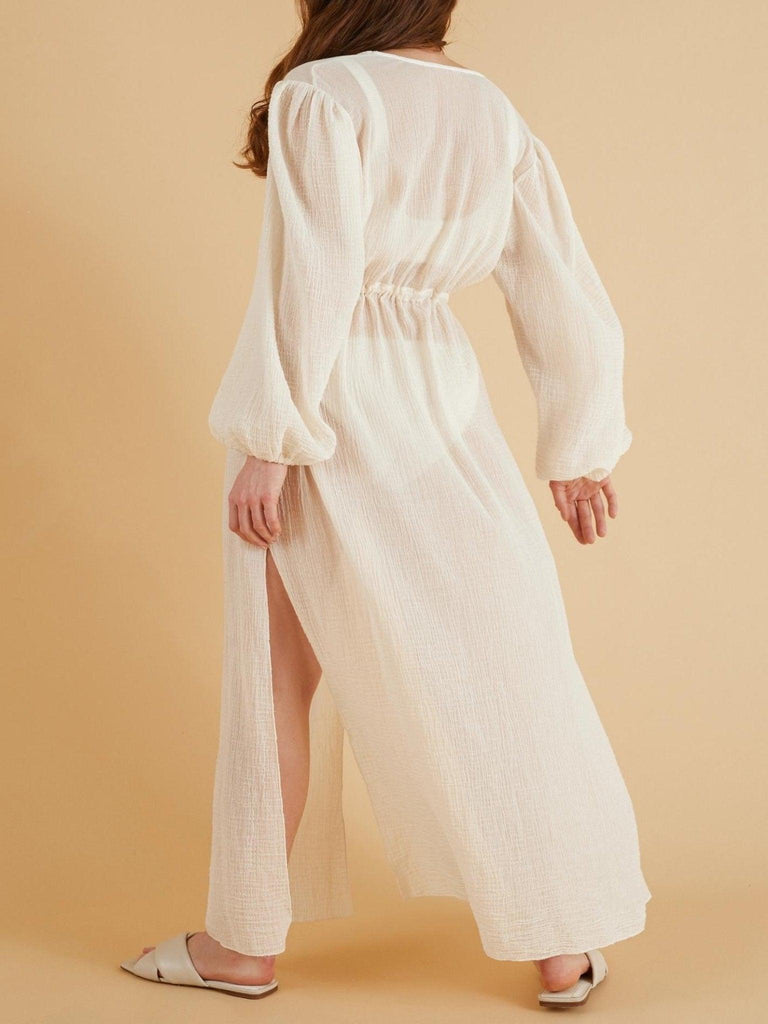 Woman gracefully wearing Venus Sheer Kimono, a lightweight 100% Turkish cotton garment, perfect for lounging.